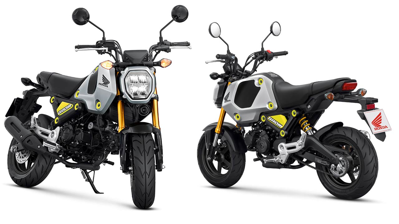 Hondas Zwerg-Motorrad MSX125 heißt künftig Grom – hier in der Farbe „Force Silver Metallic“ mit auffälligen Verkleidungsbefestigungen und einer nach Aufmerksamkeit heischenden Heckfeder in Gelb.
